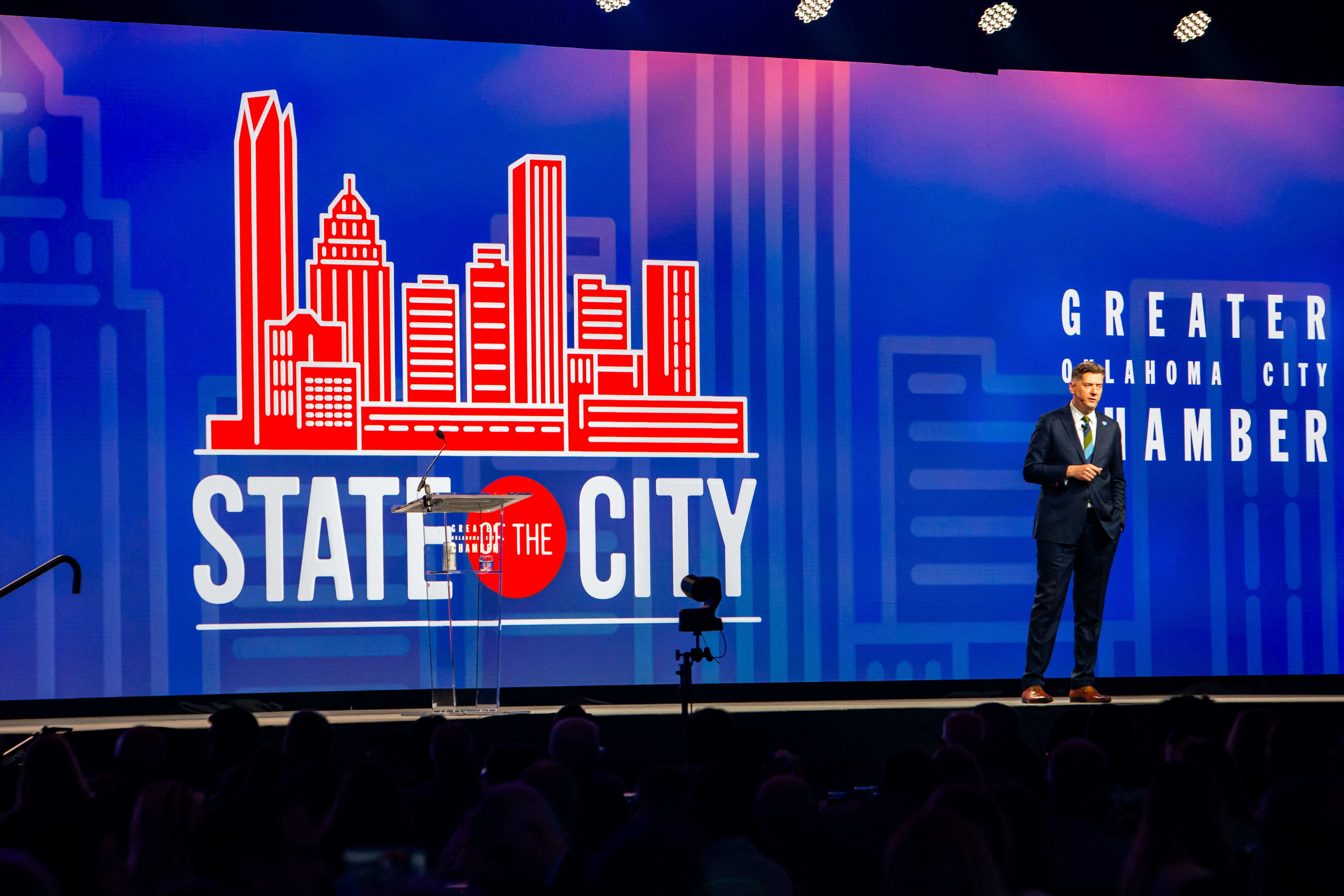 Mayor Holt presenting State of the City on stage