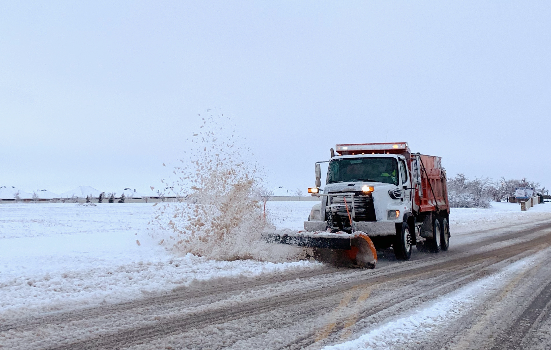 okc snow plow clearing snow on city street