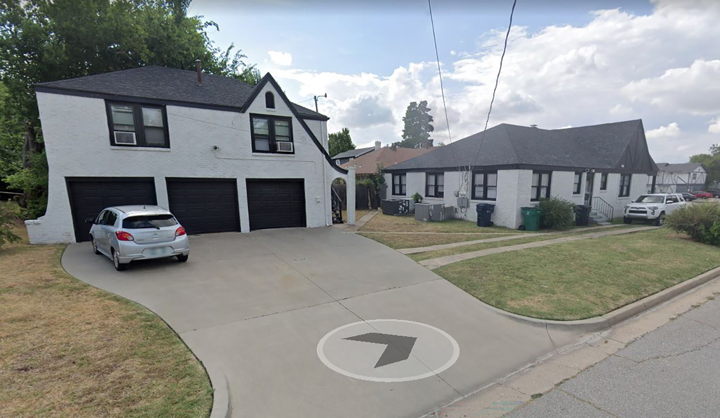 corner lot house with multiple garage apartments off the driveway