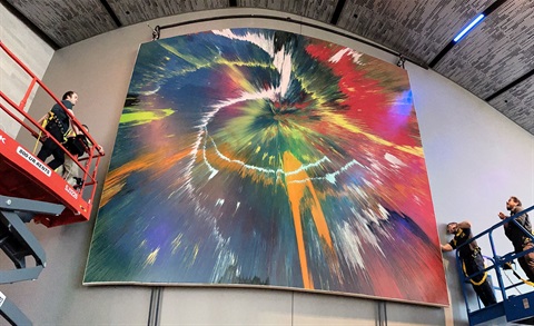 wide angle view of colorful abstract mural on the wall