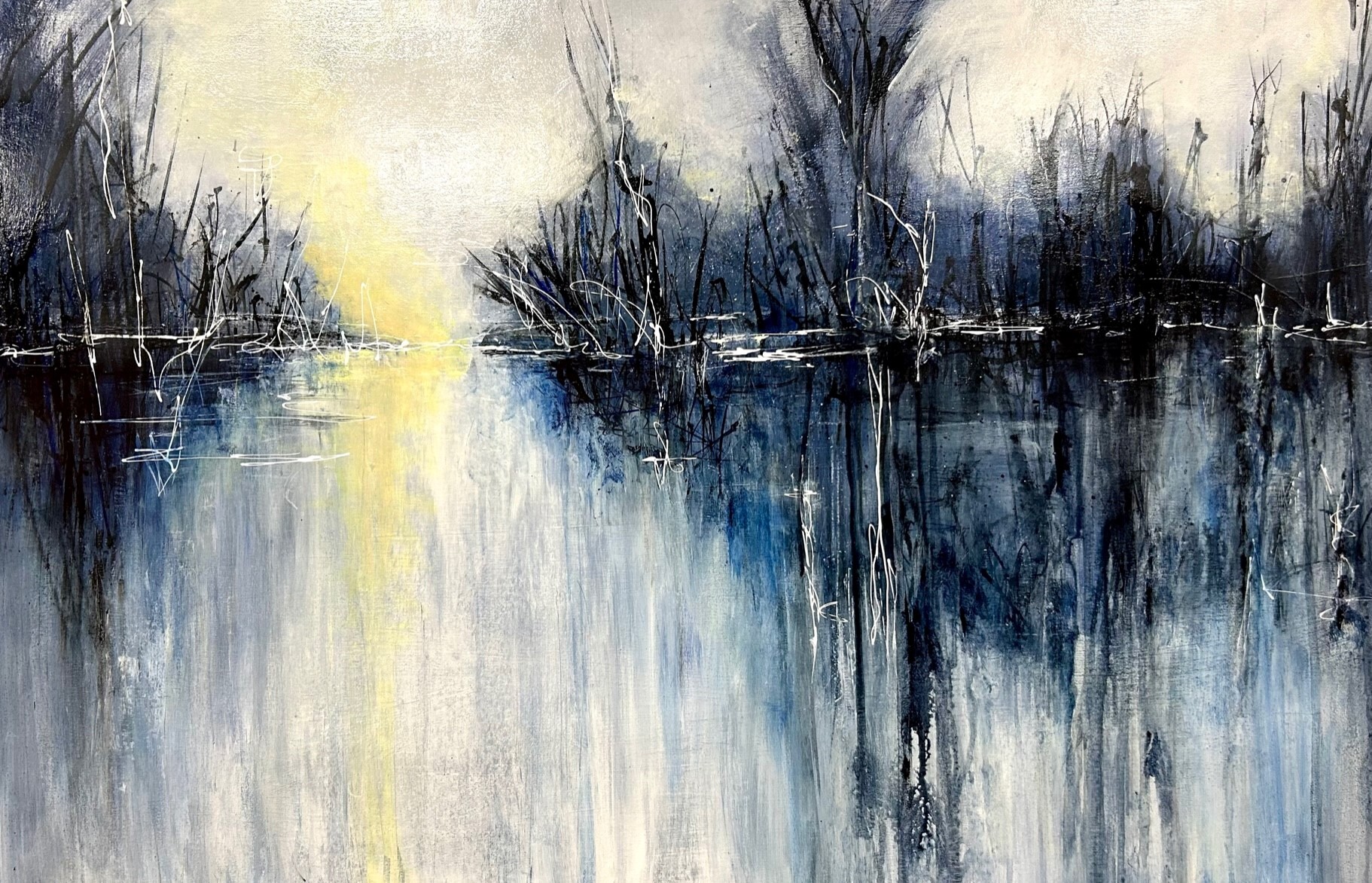 abstract scene of pond near dormant trees