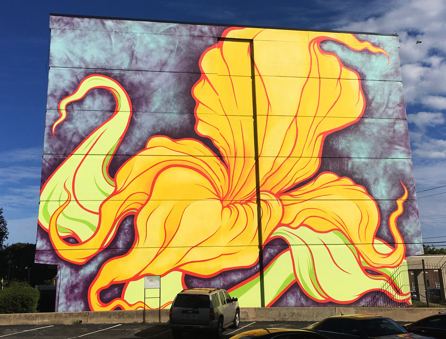 multi story yellow flower mural