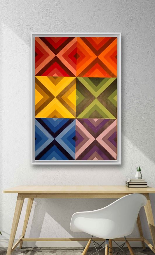 rainbow colors painting with quilt like square hanging above desk