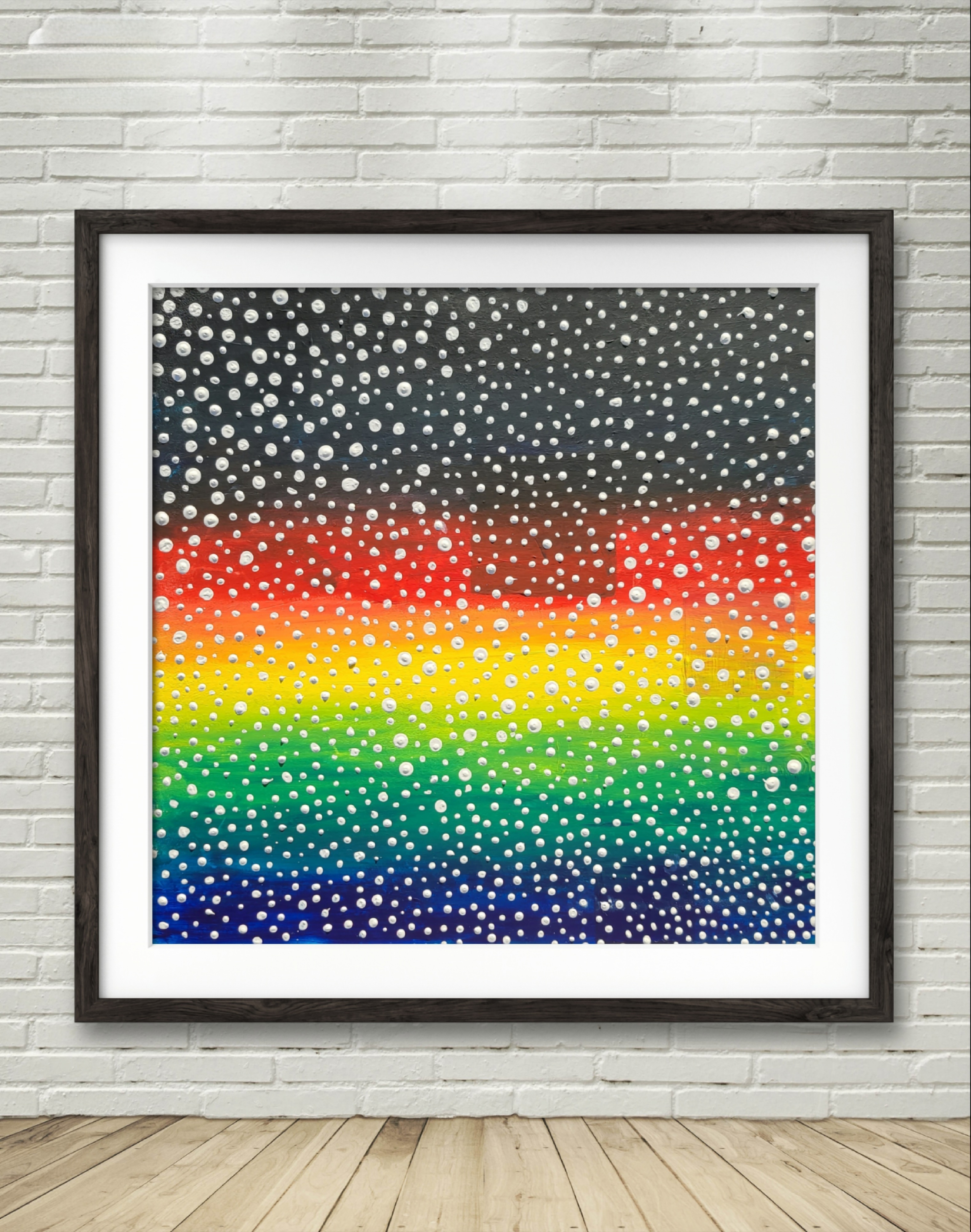 painting of rainbow colors with white dots covering it