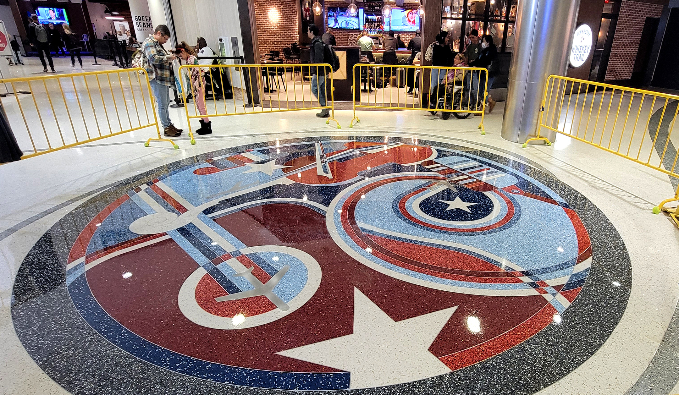 circular tile mosaic with airplane and instruments
