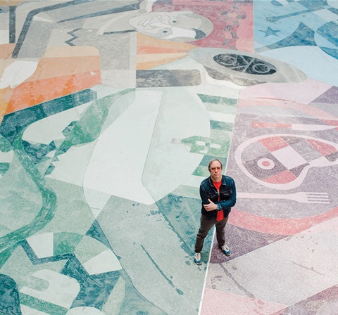 guy standing on tile mosiac floor