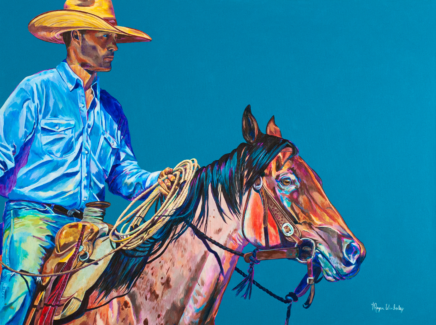 guy in demin and cowboy hat riding brown horse