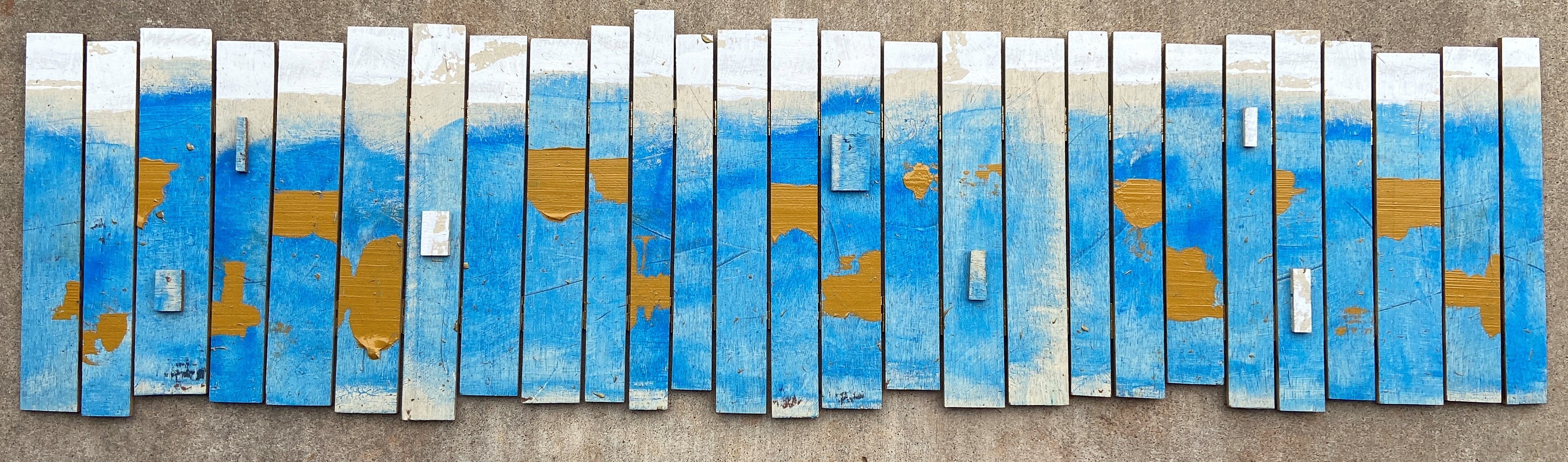 wood pieces painted multiple colors