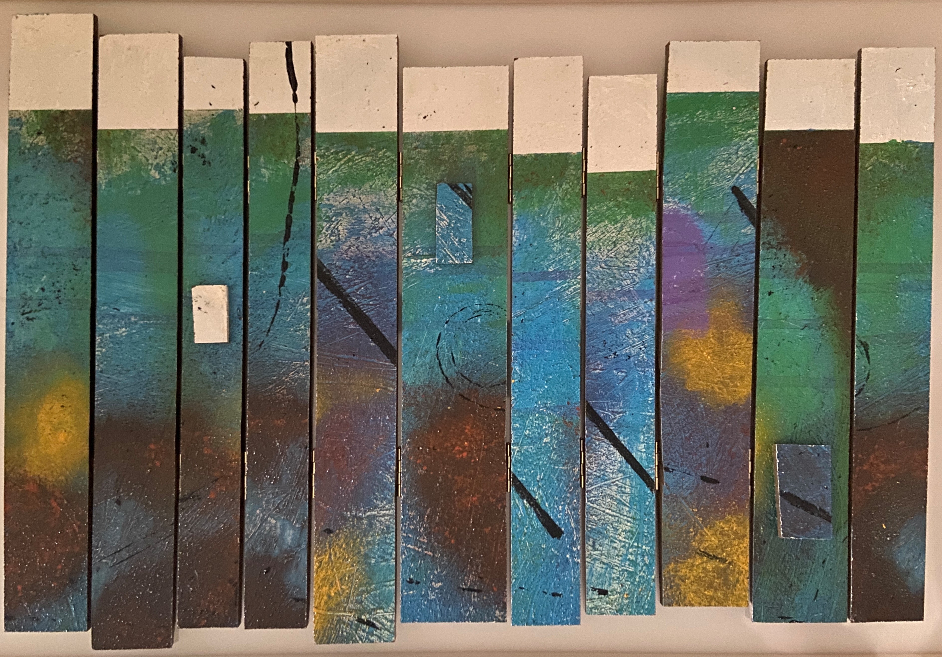 wood pieces painted multiple colors