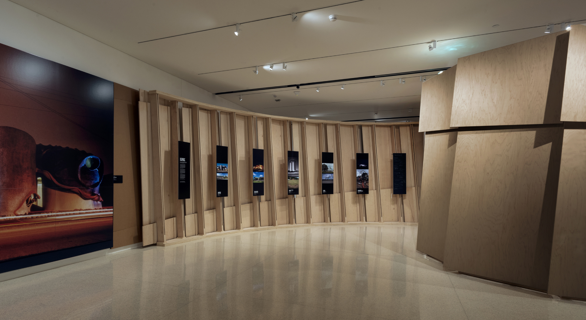 exhibit of images on rods in wood case