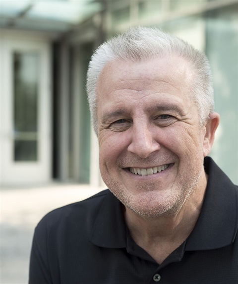 older white man wearing black shirt