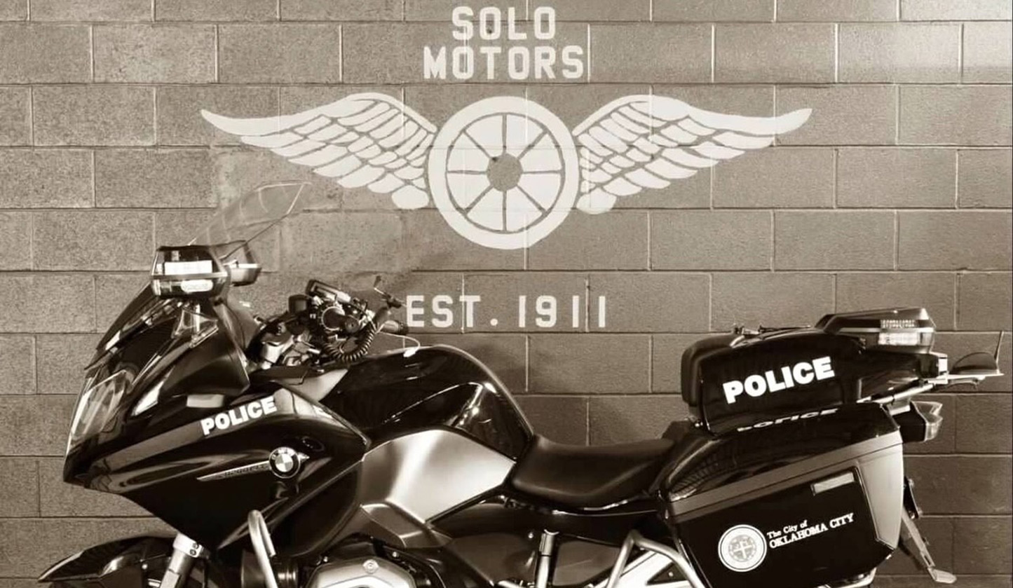 black and white photo of okcpd motorcycle