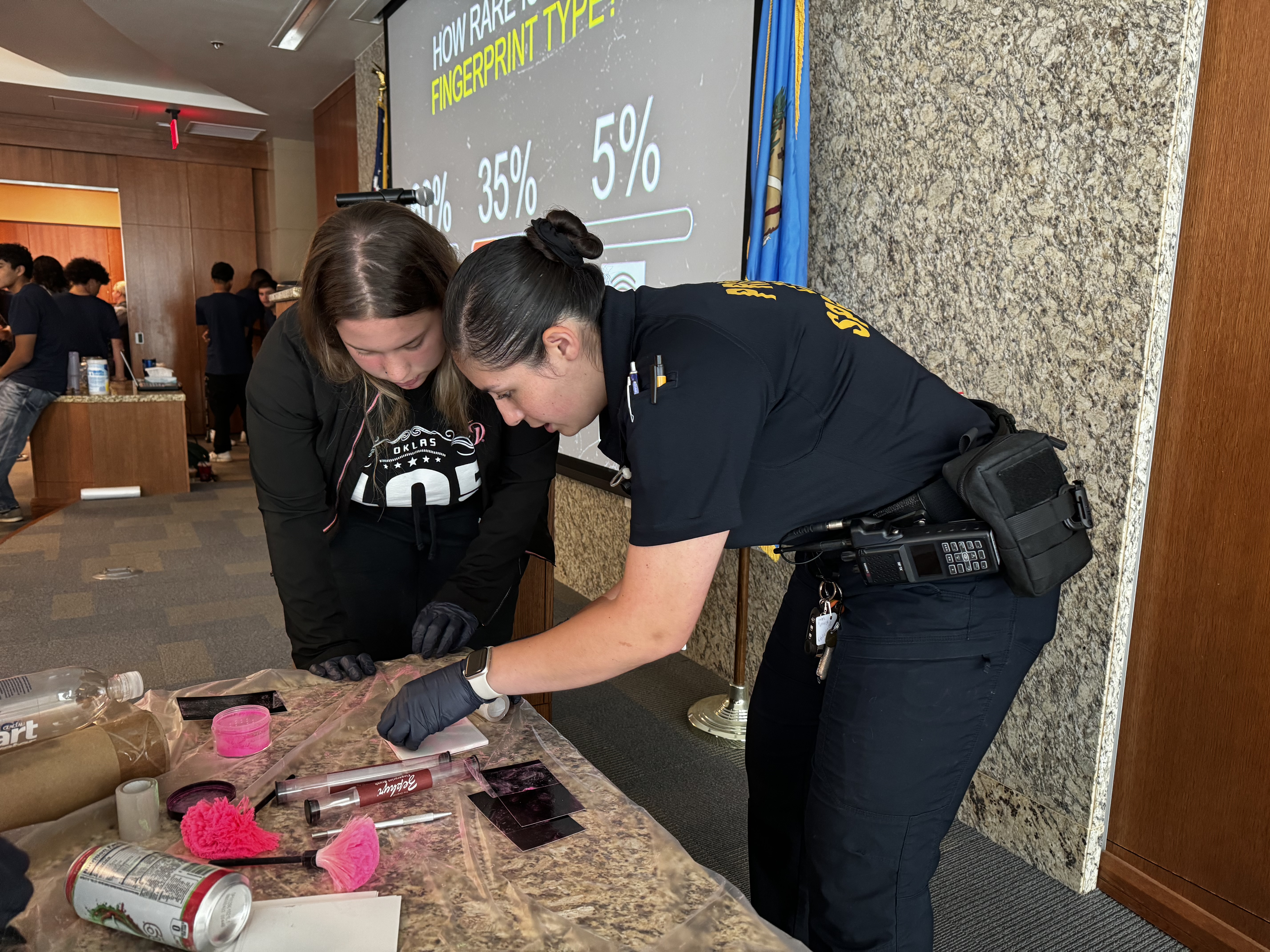 OKCPD employee showing student CSI techniques
