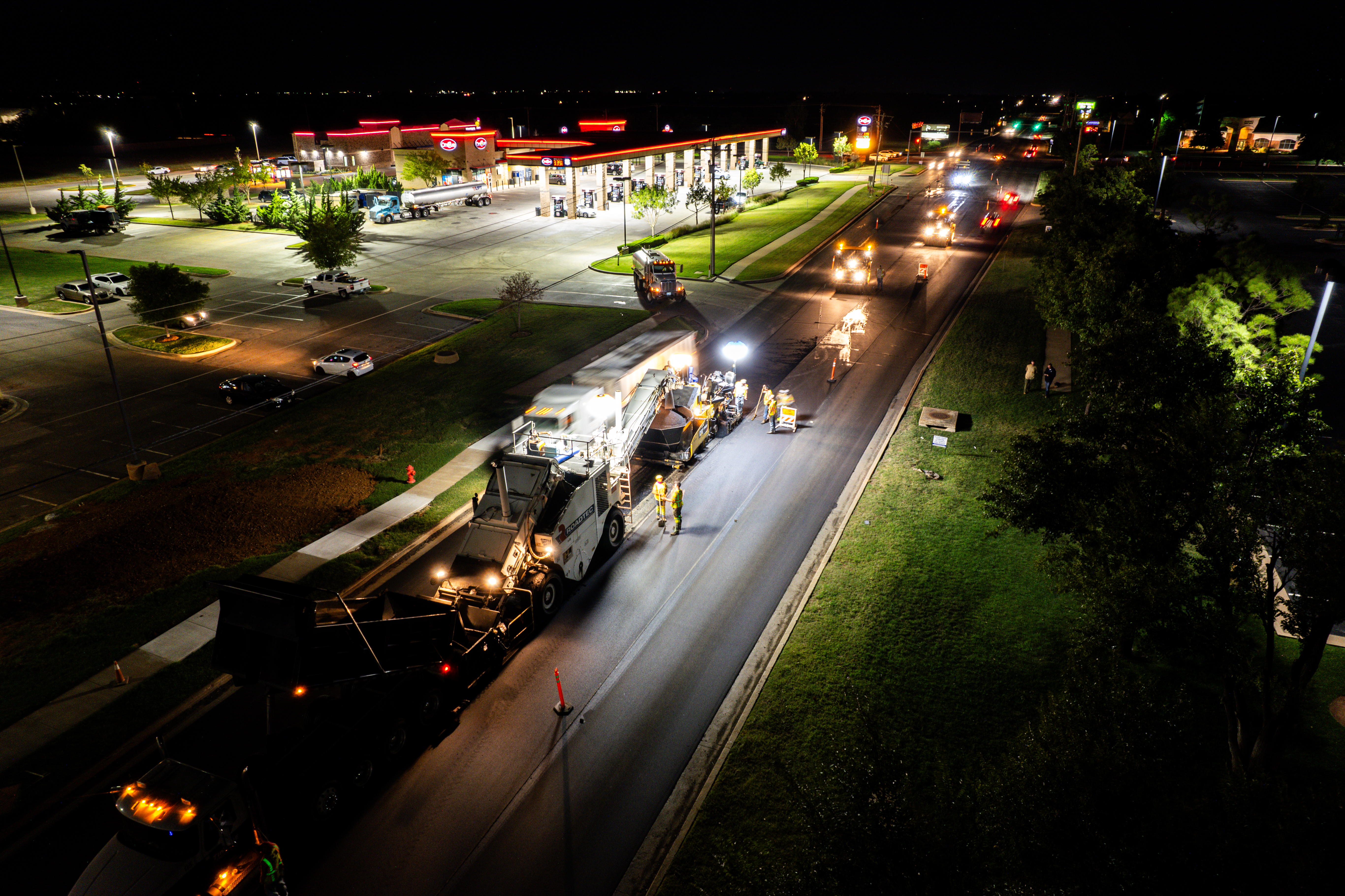 road construction at night in front of gas station