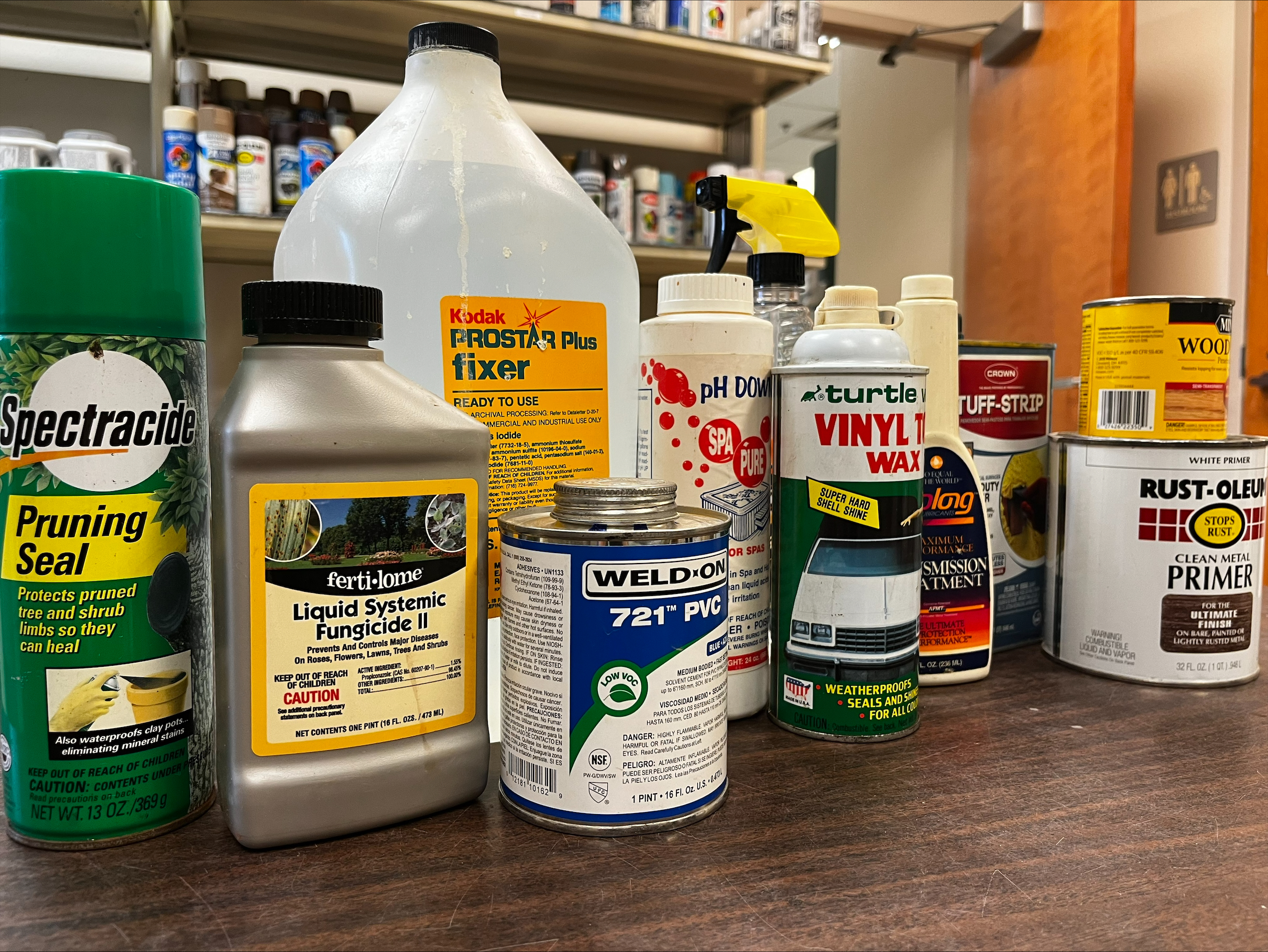Row of expired household products on table