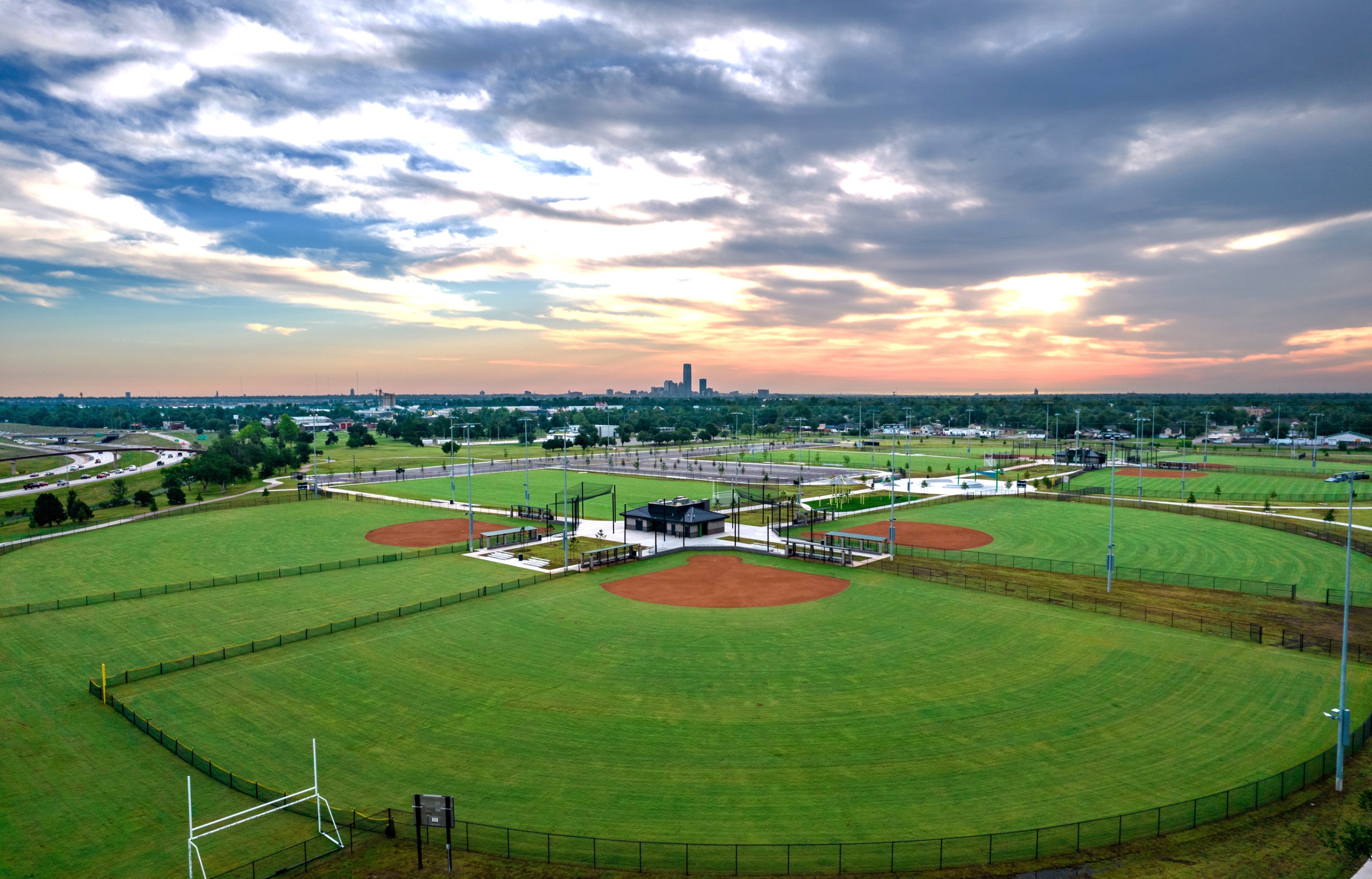 Drone view of Woodson Park with downtown okc in the background