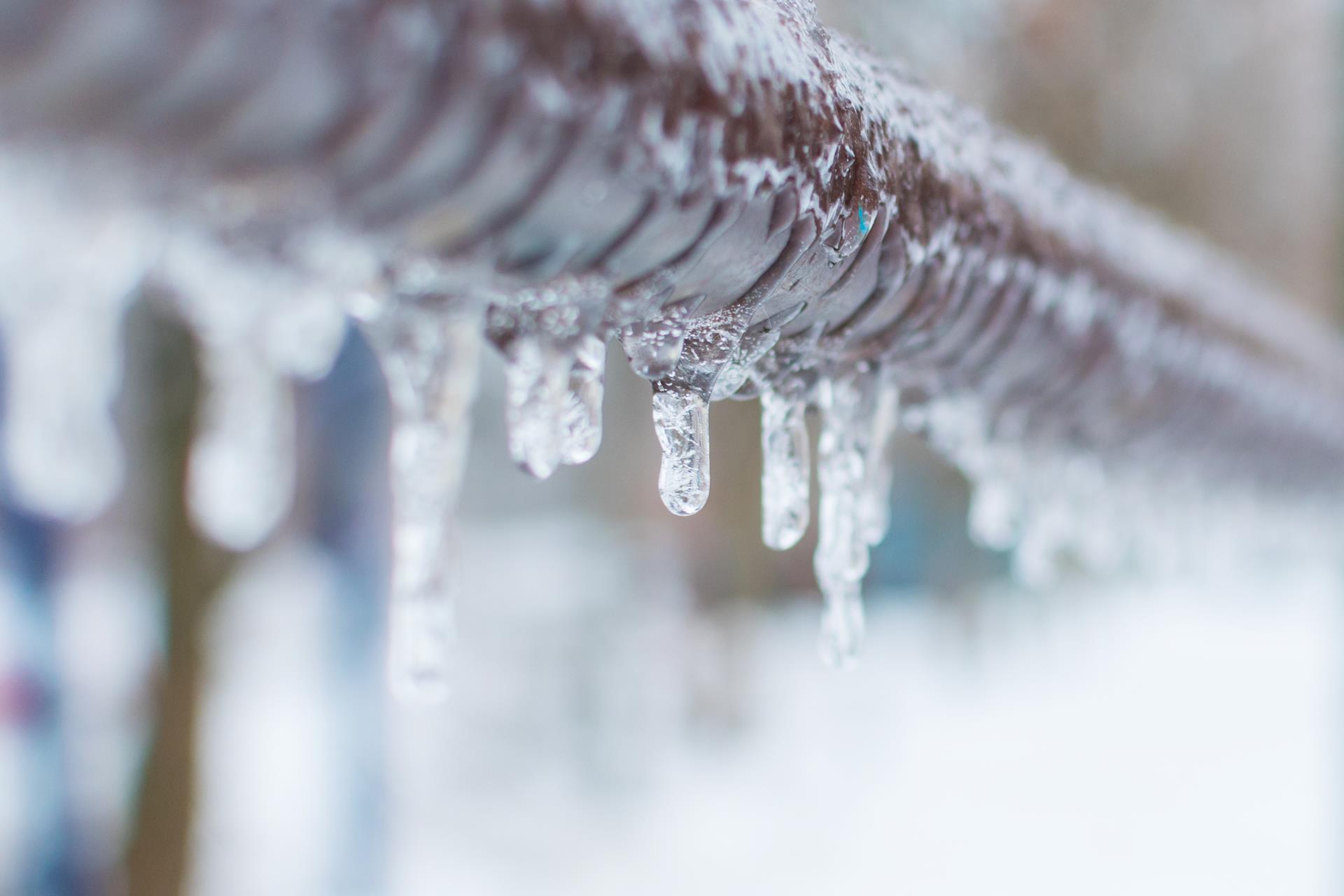 Ice hanging from a frozen waterline. 